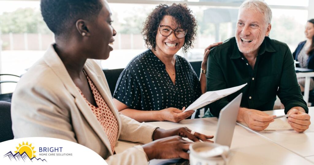 A couple talks with and advisor, representing the type of preparation that is crucial for successful senior care planning.