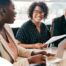 A couple talks with and advisor, representing the type of preparation that is crucial for successful senior care planning.