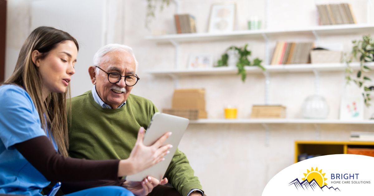 Home caregiver assisting senior man to use telehealth and senior care